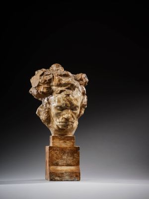 an image of a sculpture of a woman ' s head on a wooden stand