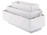 a white box with three compartments and a pen in it