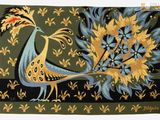 an image of a rug with a bird and flowers on it