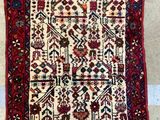 a rug with a pattern on it and fringes on the ground