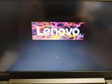 a laptop that has a lenovo logo on the screen