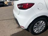 a white car that is parked in a parking lot