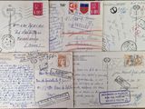 several envelopes with stamps and stamps on them on a wooden table