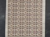 two sheets of paper with designs on them on a table