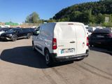 a white van that is parked in a parking lot
