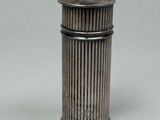 an antique silverplated salt shaker with a domed top