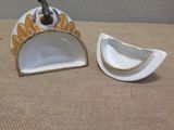 a small white bowl and a small white bowl on a table