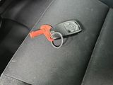 a car key in the back seat of a car