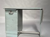 a small desk with a drawer on top of it