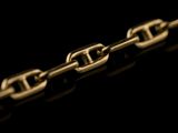 a close up of a chain on a black background
