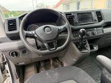a dashboard of a car with a steering wheel and dashboard controls