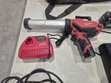 a cordless drill and a cordless hammer on a table