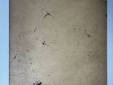 an old piece of paper sitting on top of a white table