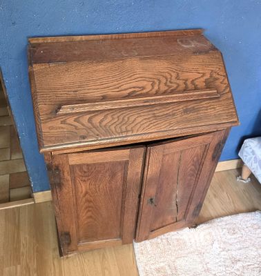 a small wooden desk with a drawer underneath it