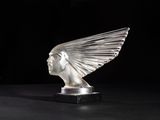 an image of a glass sculpture of a woman ' s head on a black surface