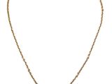 a gold necklace with a picture of a woman on it