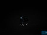 a black diamond in the dark with a black background