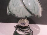 a lamp that is sitting on a table in a room