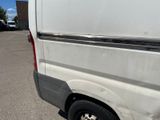 a white van that is parked in a parking lot