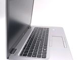 a close up of a laptop computer on a white surface