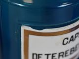 a close up of a bottle of coffee on a table