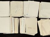a lot of papers that are on a table
