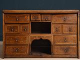 an old wooden dresser with many drawers and drawers on it