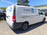 a white van that is parked in a parking lot