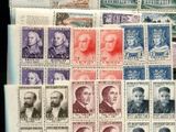 a pile of stamps with a lot of different pictures on them