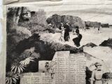 an old newspaper with a picture of a man and a woman on the beach