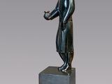 an image of a statue of a woman standing on a pedestal