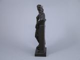 statue of a man holding a sword on a black base