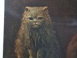 a picture of a cat that is sitting on a table