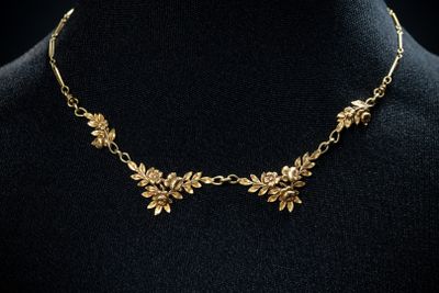 a gold necklace on a mannequin mannequin mannequin mannequin mannequin mannequin mannequin mannequin mannequin