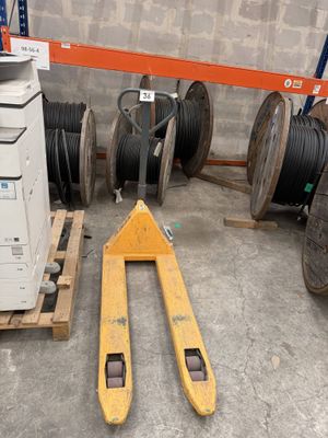 a pallet that is sitting next to a stack of wires