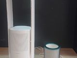 an image of a white air purifier on a wooden table