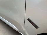 a close up of a car door with a sticker on it