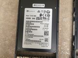 two hard drives and a hard drive on the floor