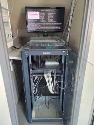 an image of a server rack with a computer on top of it