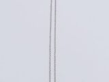silver plated necklace with a circle pendant and a chain on a white background