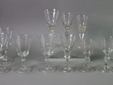 a lot of wine glasses that are sitting on a table