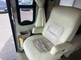 a chair that is sitting in the back of a bus