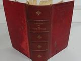 an old red book opened to show the contents of a book