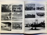 many pictures of airplanes in this book on the table