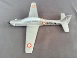 a small model of a fighter jet on a table