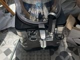 a small machine that is sitting on a tiled floor