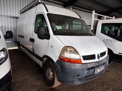 two white vans parked in a garage next to each other