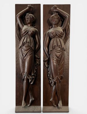 pair of bronze sculptures of a woman and a man