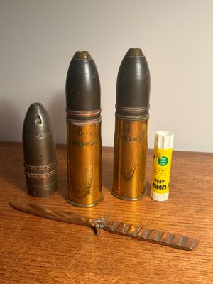 a knife and some bullet shaped objects on a table