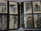a person holding a binder with a bunch of pictures on it